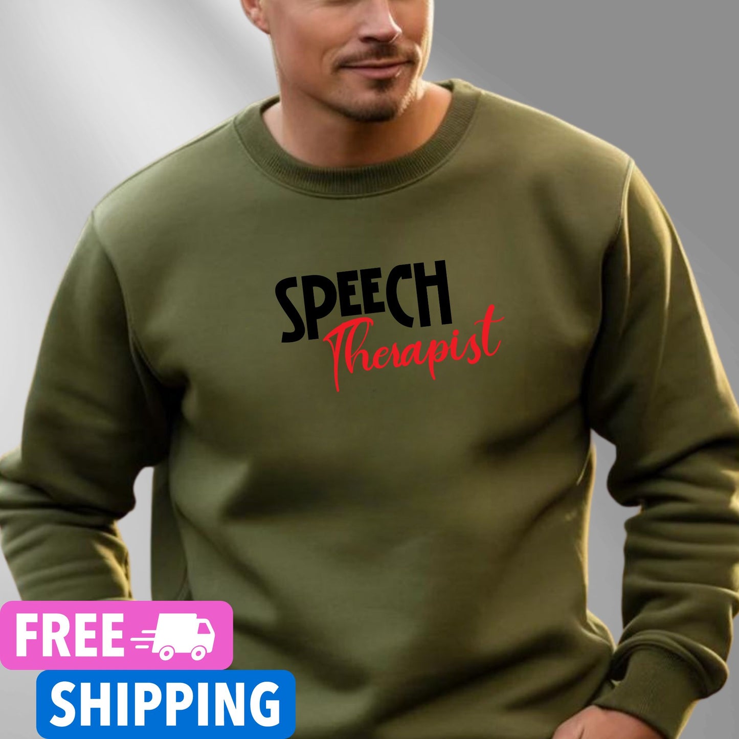 Person wearing a Military Green Speech Therapist statement clothing crew neck sweatshirt with bold black and red text, standing in a modern interior setting.