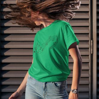 Woman wearing a irish green Love Music Sheet T-shirt from Yebber, featuring a heart-shaped music sheet design – statement clothing for music lovers.