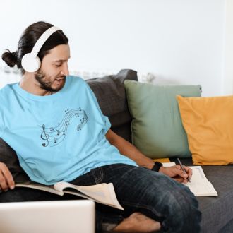 Man wearing a sky Love Music Sheet T-shirt from Yebber, featuring a heart-shaped music sheet design – statement clothing for music lovers.