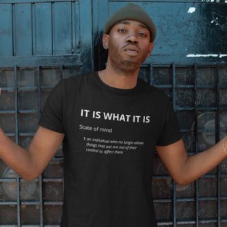 Man wearing a black IT IS WHAT IT IS T-shirt from Yebber, featuring bold typography and a dictionary-style definition—statement clothing for a carefree mindset.