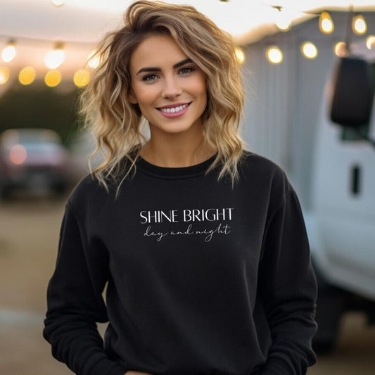 Model wearing the Shine Bright, Day and Night sweatshirt, demonstrating its versatile and timeless style in a casual setting.