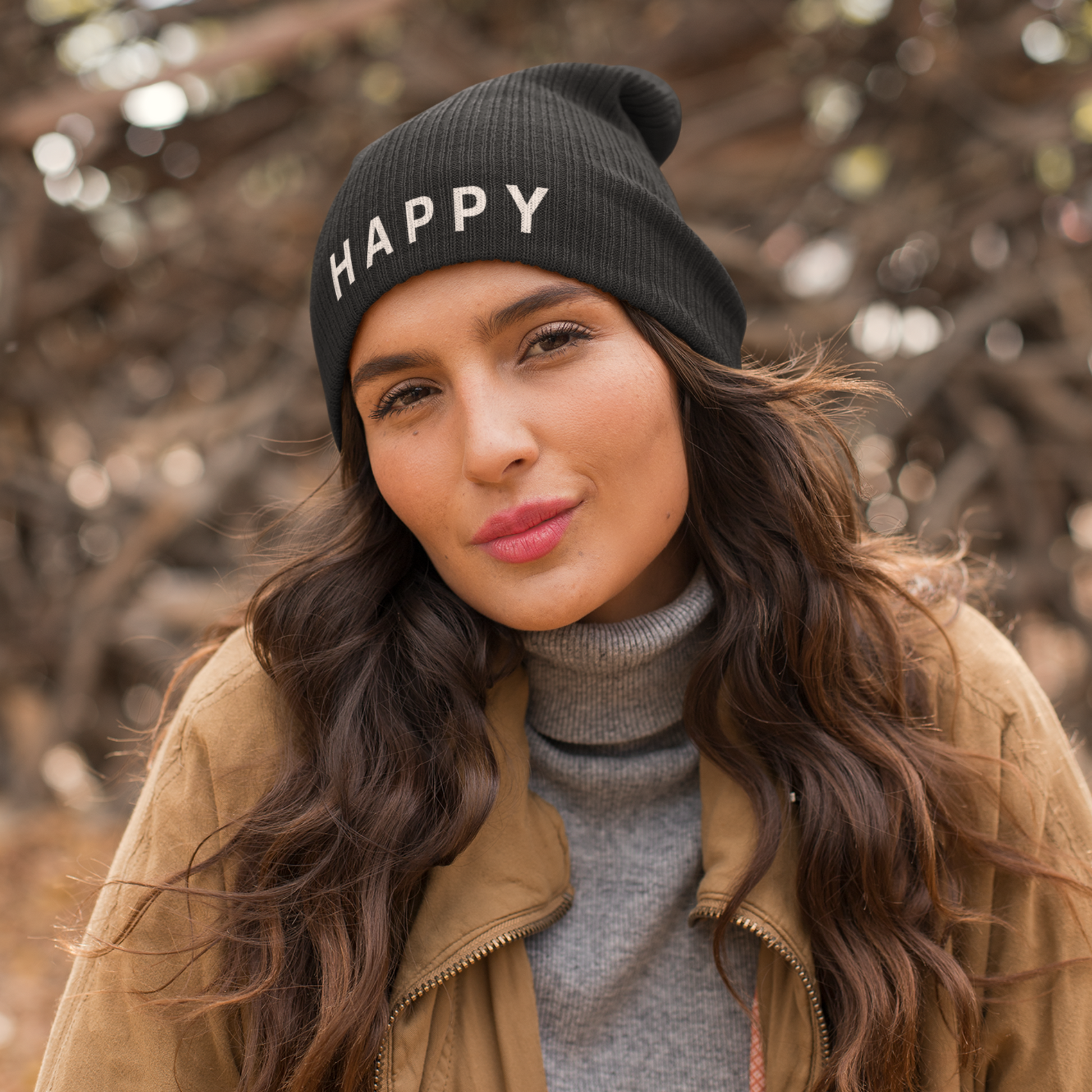 Close-up of a person wearing a black Happy Embroidered Beanie from Yebber, featuring minimalist text embroidery on a cozy cotton-acrylic blend – statement clothing for positive thinkers.
