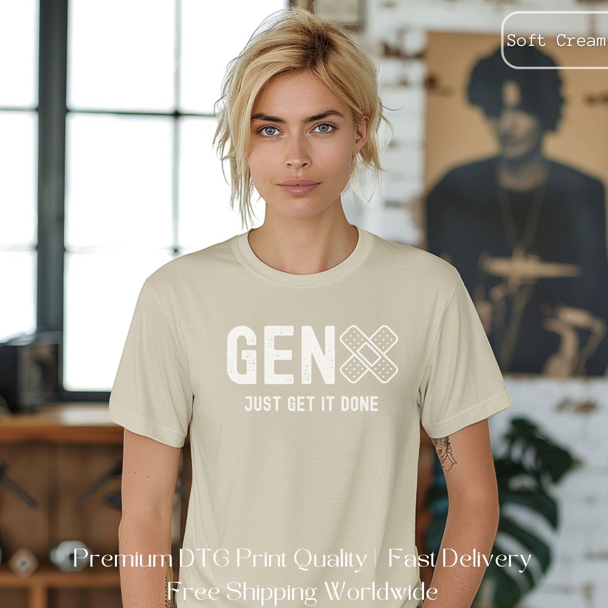 Woman wearing a soft cream Gen X statement clothing T-shirt with the text "Just Get It Done," standing in an industrial setting. Premium DTG print quality, fast delivery, and free worldwide shipping by Yebber.