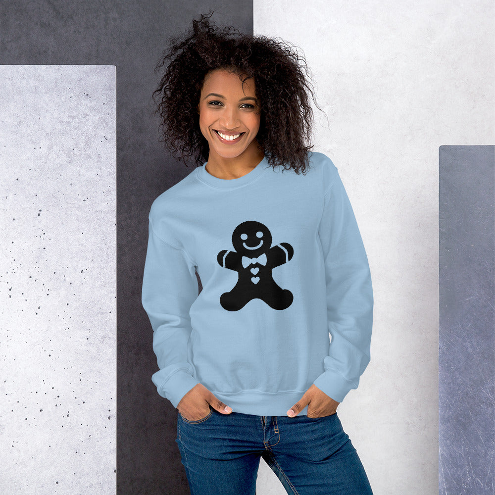 Person wearing a Light Blue Minimalistic Christmas statement clothing sweatshirt with a black gingerbread man design.