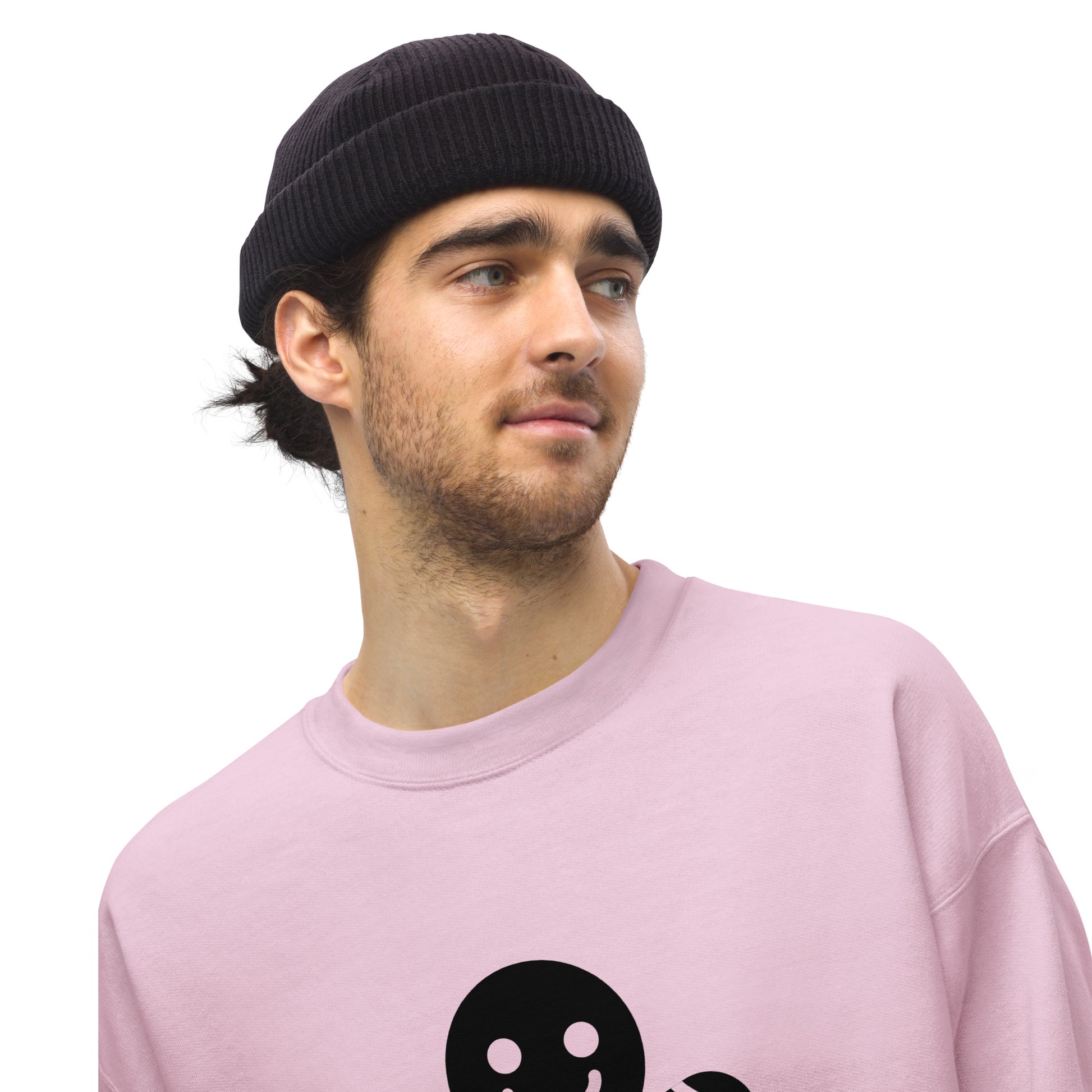 Person wearing a Light Pink Minimalistic Christmas statement clothing sweatshirt with a black gingerbread man design.