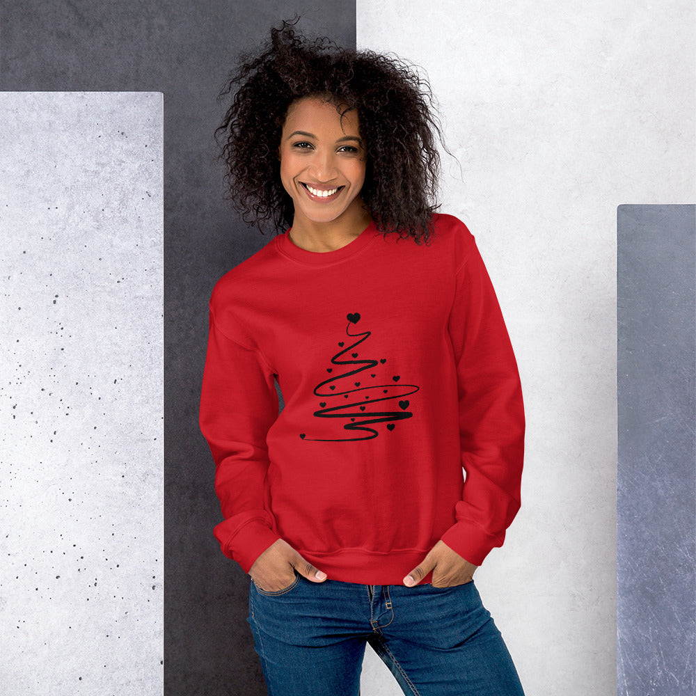 Person wearing a red Minimalistic Christmas statement clothing sweatshirt with a black abstract Christmas tree design.