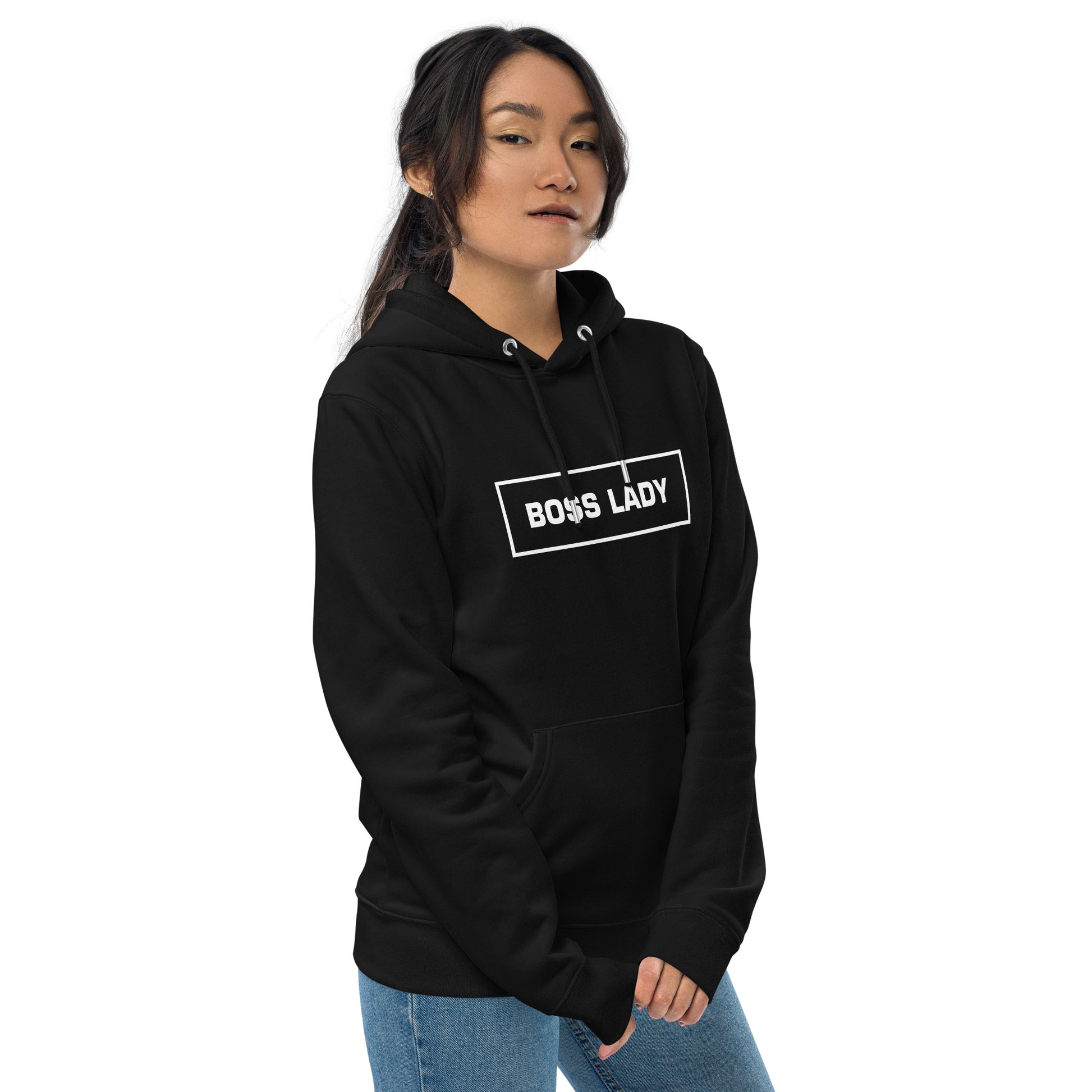 Woman wearing a black Boss Lady statement clothing hoodie with bold white text frm the side.