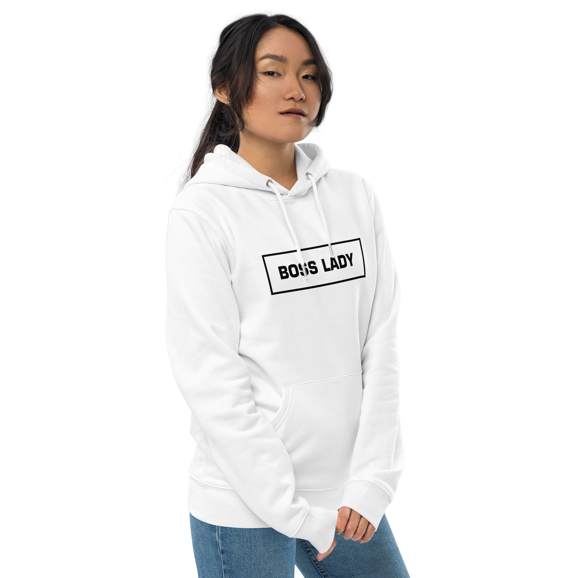 Woman wearing a white Boss Lady statement clothing hoodie with bold black text from the side.