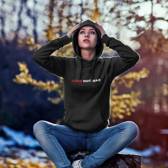 Person wearing a black Love Not War Hoodie from Yebber, featuring bold typography promoting peace – statement clothing for advocates of harmony.

