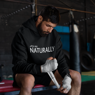 Man wearing a black mRNA FREE Hoodie from Yebber, featuring bold typography symbolizing informed choice – statement clothing for independent thinkers.