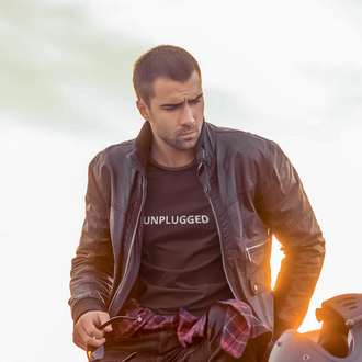 Man wearing a black Unplugged T-shirt from Yebber, featuring a bold message of freedom from mainstream narratives – statement clothing for independent thinkers.

