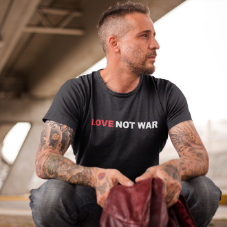 Man wearing a black Love Not War T-shirt from Yebber, featuring a bold message promoting peace and unity – statement clothing for advocates of love over conflict.