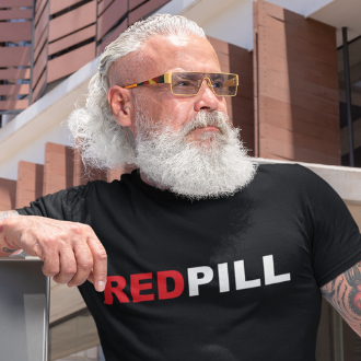 Man wearing a black Red Pill T-shirt from Yebber, featuring bold red and white typography symbolizing awakening – statement clothing for truth seekers.