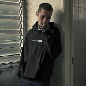 Man wearing a black Unplugged Hoodie from Yebber, symbolizing freedom from societal programming – statement clothing for independent thinkers.